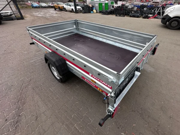 Przyczepa hamowana samochodowa lekka do przewozu quadów motocykli z burtami 40 cm i najazdem MULTITRANSPORTER 3016 750 KG DMC